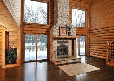 Large Living Room featuring a Fireplace and Beautiful Wood Floors, Ideal Remodeling in Menasha, WI