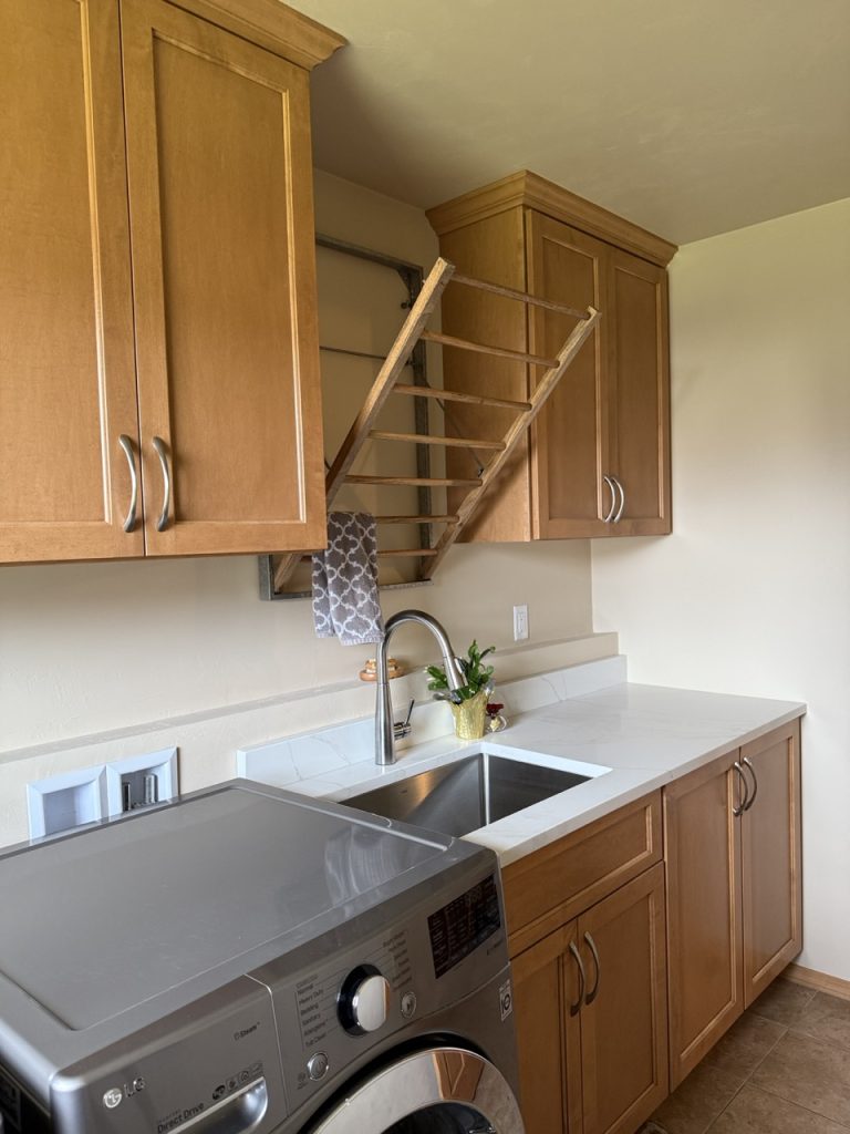 VKB laundry room brown wood interior cabinets